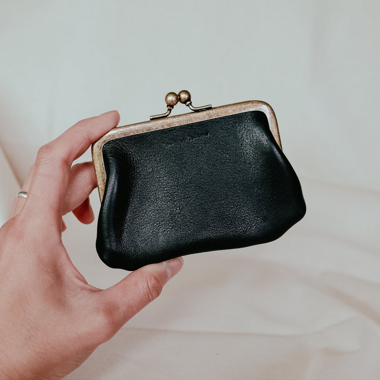 Coin purse with clasp